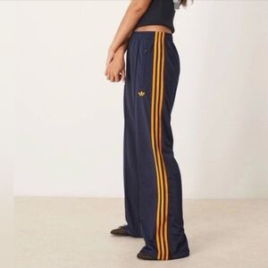 adidas Originals Navy Track Pants with Orange Stripes